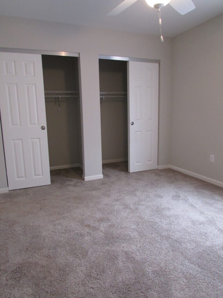 Bedroom with dual closets